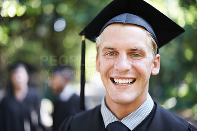 Buy stock photo Graduation, man and portrait for student, celebration and college with cap and gown in outdoor background. University male person, happy and campus for school, class and confidence in education