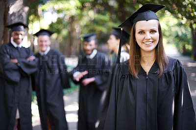 Buy stock photo Student, portrait and graduation with woman outdoor at university, college and achievement ceremony. Education, campus and class at certificate, degree and school event with a smile from diploma