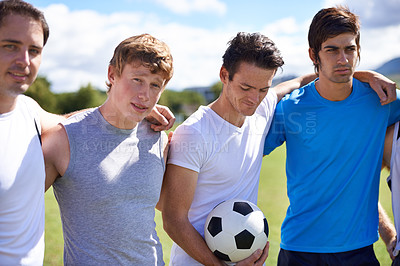 Buy stock photo Soccer, men and hug together on field for portrait at game with fitness, exercise and wellness in nature. People, teamwork and embrace for support, solidarity and football with friends in competition