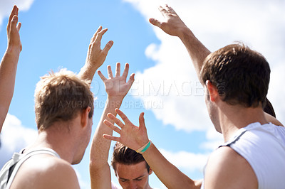 Buy stock photo Men, group and hands in air for sports on field with motivation, support and challenge with cheers. People, team building and circle with solidarity for contest, competition and workout with games