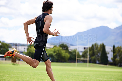 Buy stock photo Athlete male person, run and outdoor for race, jog and activewear in workout and training for wellness and sprint. Cardio, wellbeing and sport for exercise, health and fitness on grass for summer 