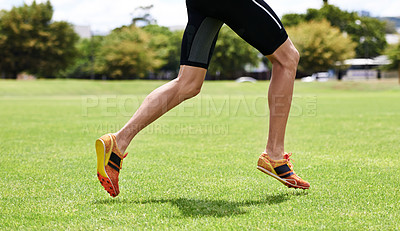 Buy stock photo Athlete, run and outdoor for race, legs and activewear in workout and training for wellness and cropped jog. Cardio, wellbeing and sport for exercise, health and fitness on grass for summer shoes