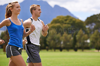 Buy stock photo Man, woman and running for exercise on field with smile for speed, wellness and training in summer. People, coach or personal trainer with runner for workout, fitness and together on grass for health