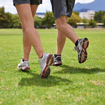 Buy stock photo People, shoes and running on grass for exercise together in summer for health, wellness or training. Person, runner and partner with feet on field for workout, fitness and speed with sneakers outdoor