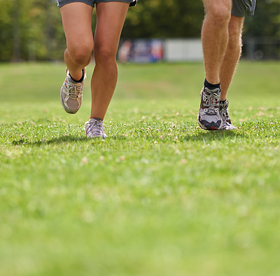 Buy stock photo People, running shoes and closeup on grass for workout together in summer for health, wellness or training. Person, runner and partner with feet on field for exercise, fitness and speed with sneakers