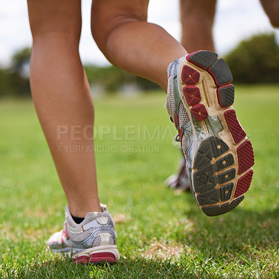 Buy stock photo People, running shoes and closeup on grass for exercise together in summer for health, wellness or training. Person, runner and partner with feet on field for workout, fitness and speed with sneakers