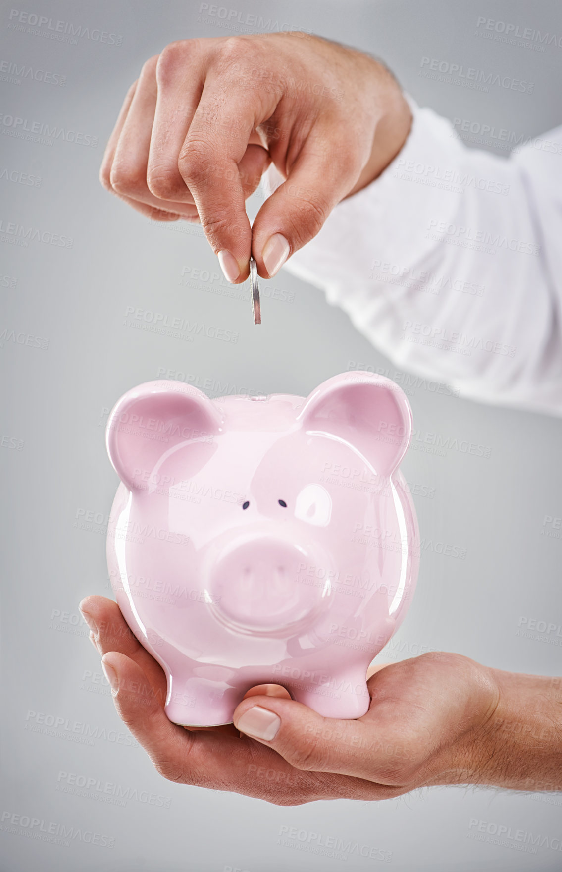 Buy stock photo Hands, coin in piggy bank and saving for future, person has financial freedom or budget with money on grey background. Investment, finance for growth and development with security and emergency fund
