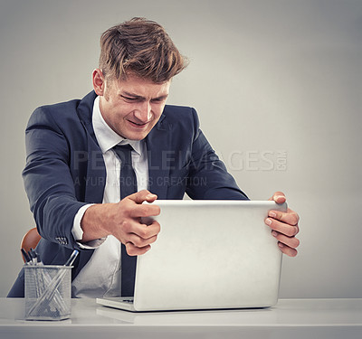 Buy stock photo Man, accountant and frustrated with laptop for finance, fail and recession in studio with anger for loss. Person, audit and budget with anxiety for low revenue, profit and depression with results