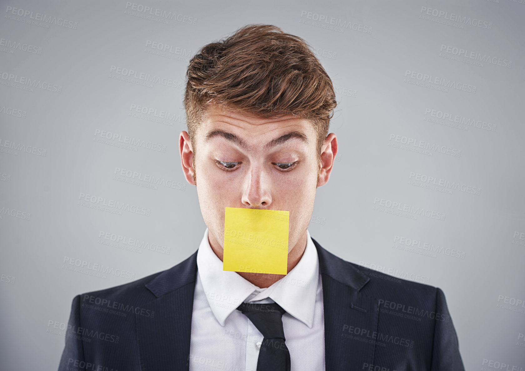 Buy stock photo Business man, sticky note and mouth in studio for silence, reminder and thinking by white background. Person, employee or corporate workout with paper on lips for compliance, censorship and quiet