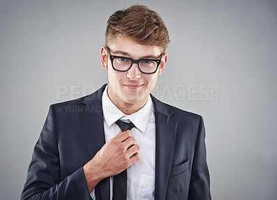 Buy stock photo Studio shot of a young man dressed in a suit