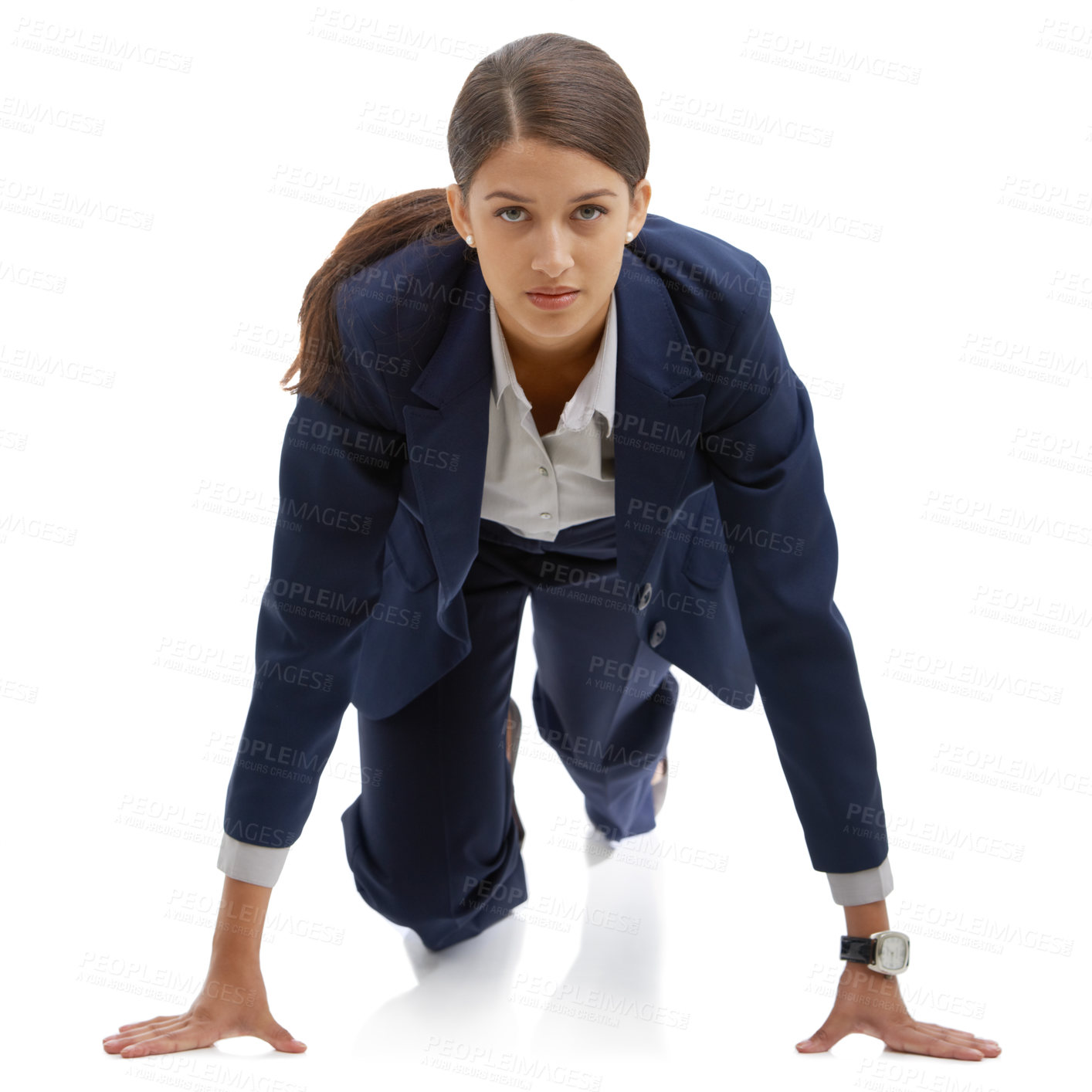 Buy stock photo Portrait of an attractive young businesswoman in a pre-running position isolated on white