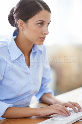 Buy stock photo Professional, woman and typing in office with computer for administration, secretary and clerk writing report. Business, assistant and employee at desk in workplace with confidence on project