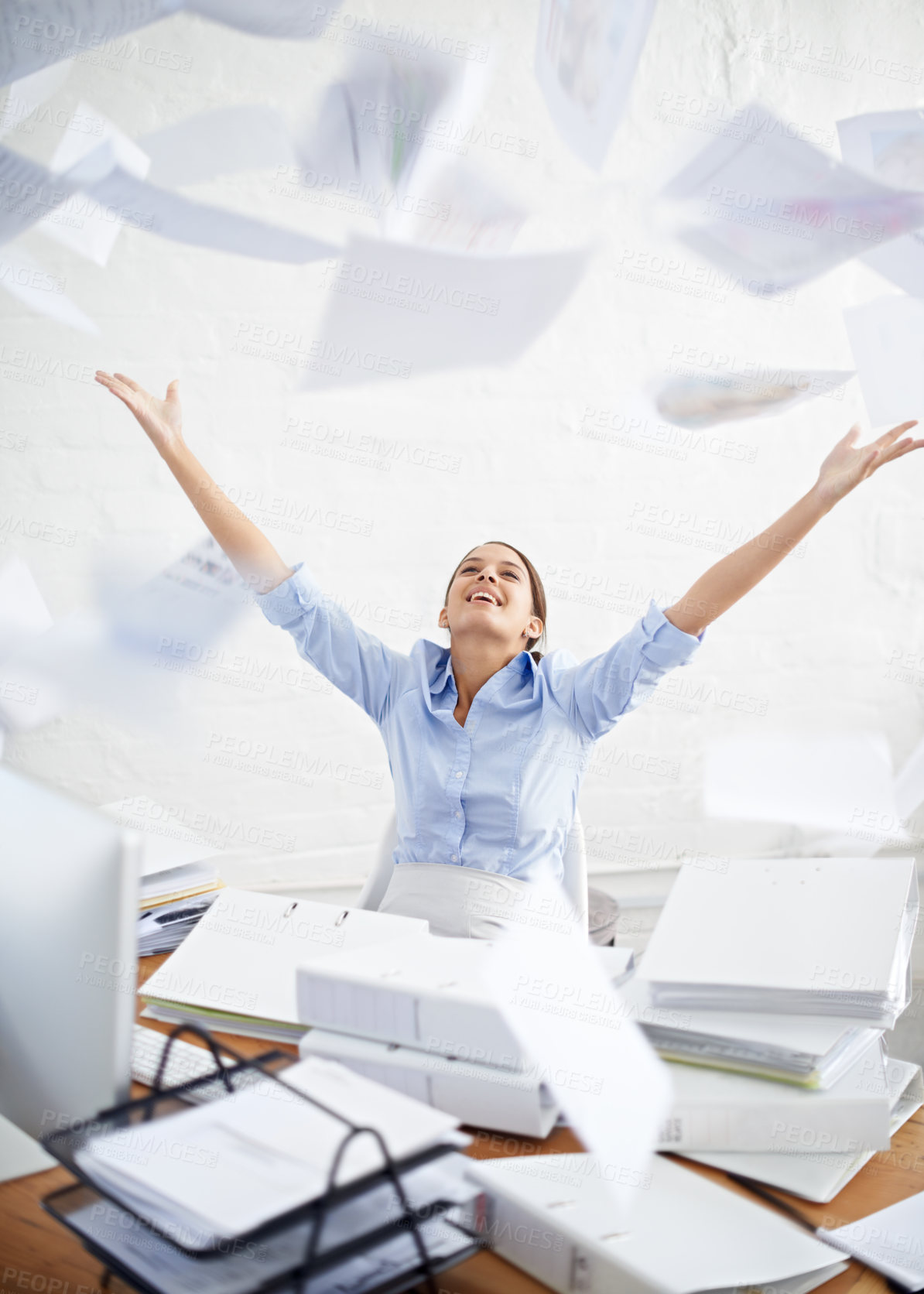 Buy stock photo Conceptual shot of a young businesswoman throwing paperwork into the air