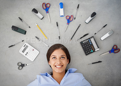 Buy stock photo Happy woman, thinking and stationery with tools for accounting, finance or creative above. Top view of female person, accountant or employee with smile or startup equipment on gray studio background