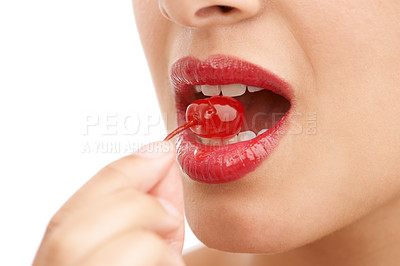 Buy stock photo Person, mouth and bite with cherry, red lipstick or cosmetics for nutrition on a white studio background. Closeup of woman, teeth or natural organic fruit with makeup or gloss for diet, fiber or glow