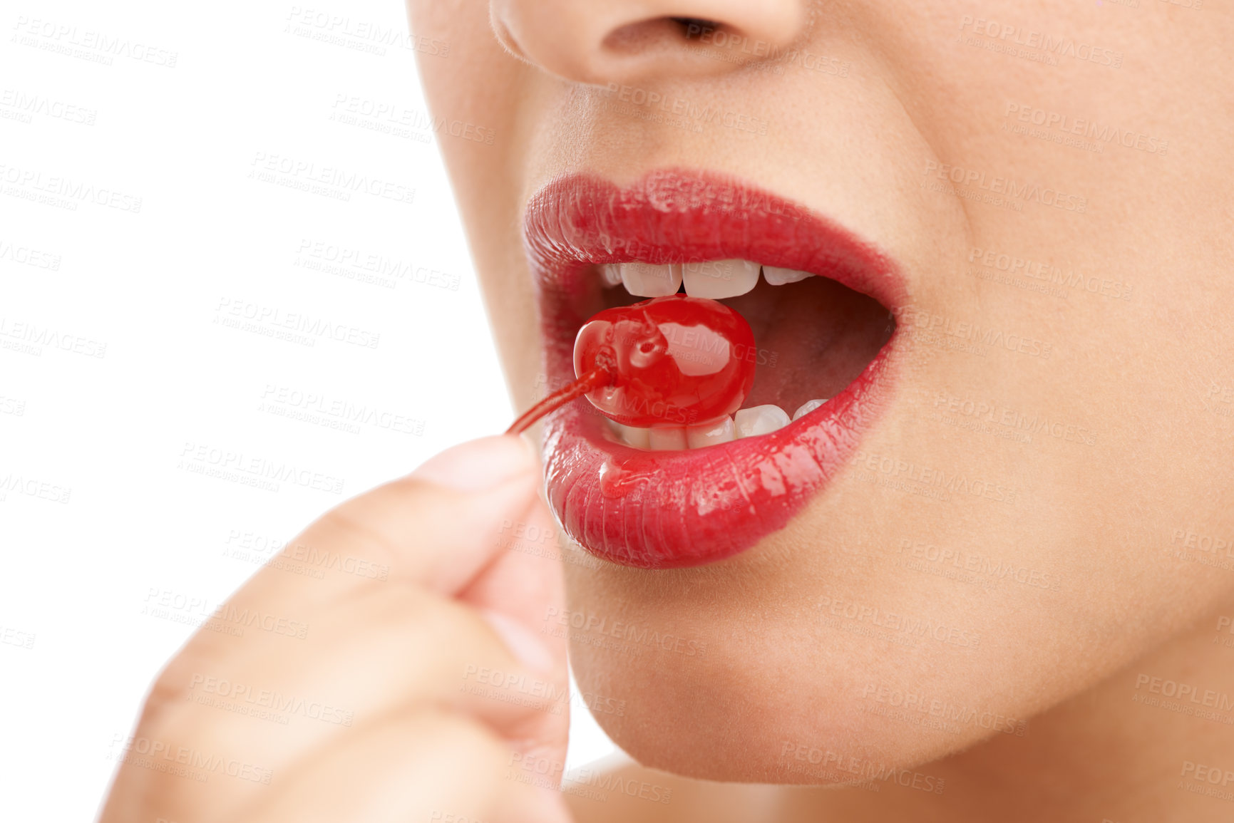 Buy stock photo Person, mouth and bite with cherry, red lipstick or cosmetics for nutrition on a white studio background. Closeup of woman, teeth or natural organic fruit with makeup or gloss for diet, fiber or glow