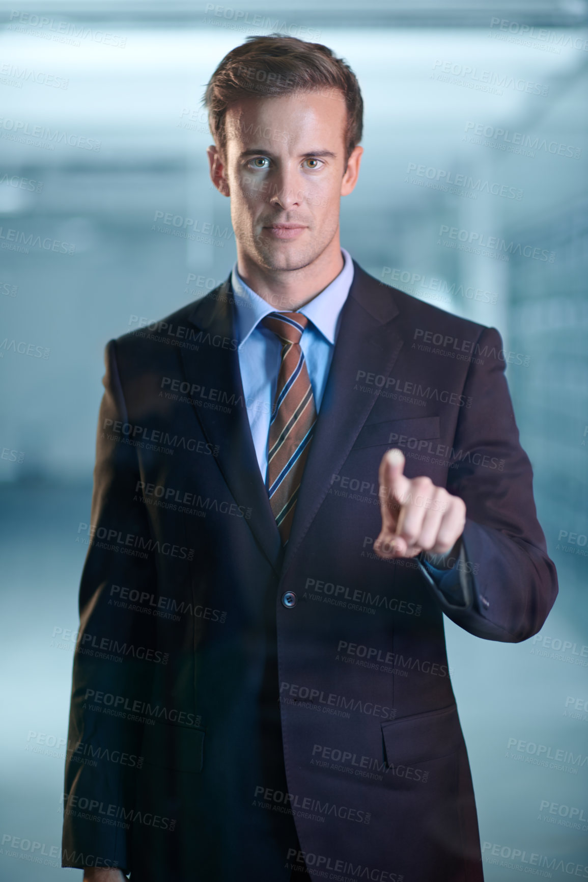 Buy stock photo Cropped portrait of a handsome young business professional using a digital interface