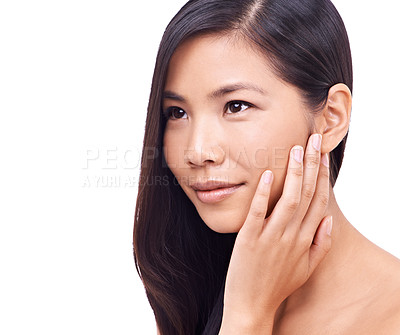 Buy stock photo Asian woman, thinking and studio with soft skin for beauty, smile and cosmetics for skincare or routine. Wellness, closeup and hand to feel healthy face with dermatology isolated on white background