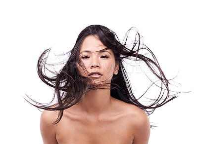 Buy stock photo Woman, portrait and windy for hair in studio, beauty and pride for keratin treatment on mockup space. Asian female person, breeze and shampoo for cosmetic on white background, haircare and creative