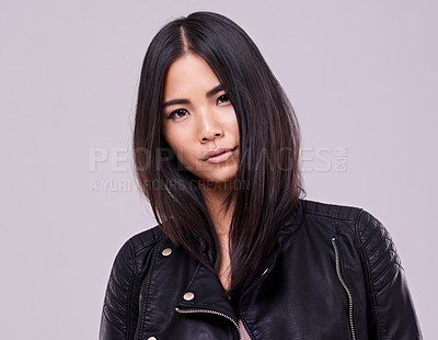 Buy stock photo Asian woman and fashion with jacket in confidence on studio, style and casual in grey background. Portrait, female person and trendy with leather top, clothes and outfit for streetwear and gen z