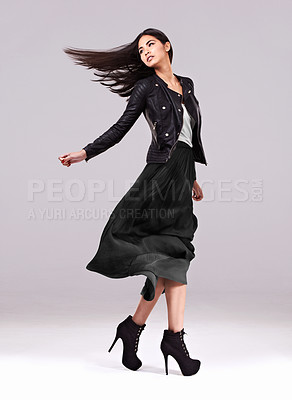 Buy stock photo Studio shot of a beautiful young woman wearing high fashion attire