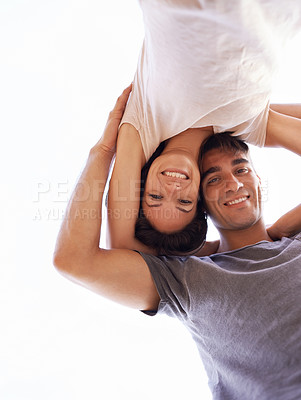 Buy stock photo Couple, portrait and smile from low angle, outdoors and romance or bonding time. Happy man, loving woman and honeymoon or travel together in summer, nature and sky while affectionately embracing 
