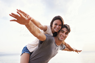 Buy stock photo Couple, beach and piggyback with freedom, smile and nature with travel and date for relationship. Man, woman and indonesia sea for adventure, vacation and tropical holiday with sunshine and portrait