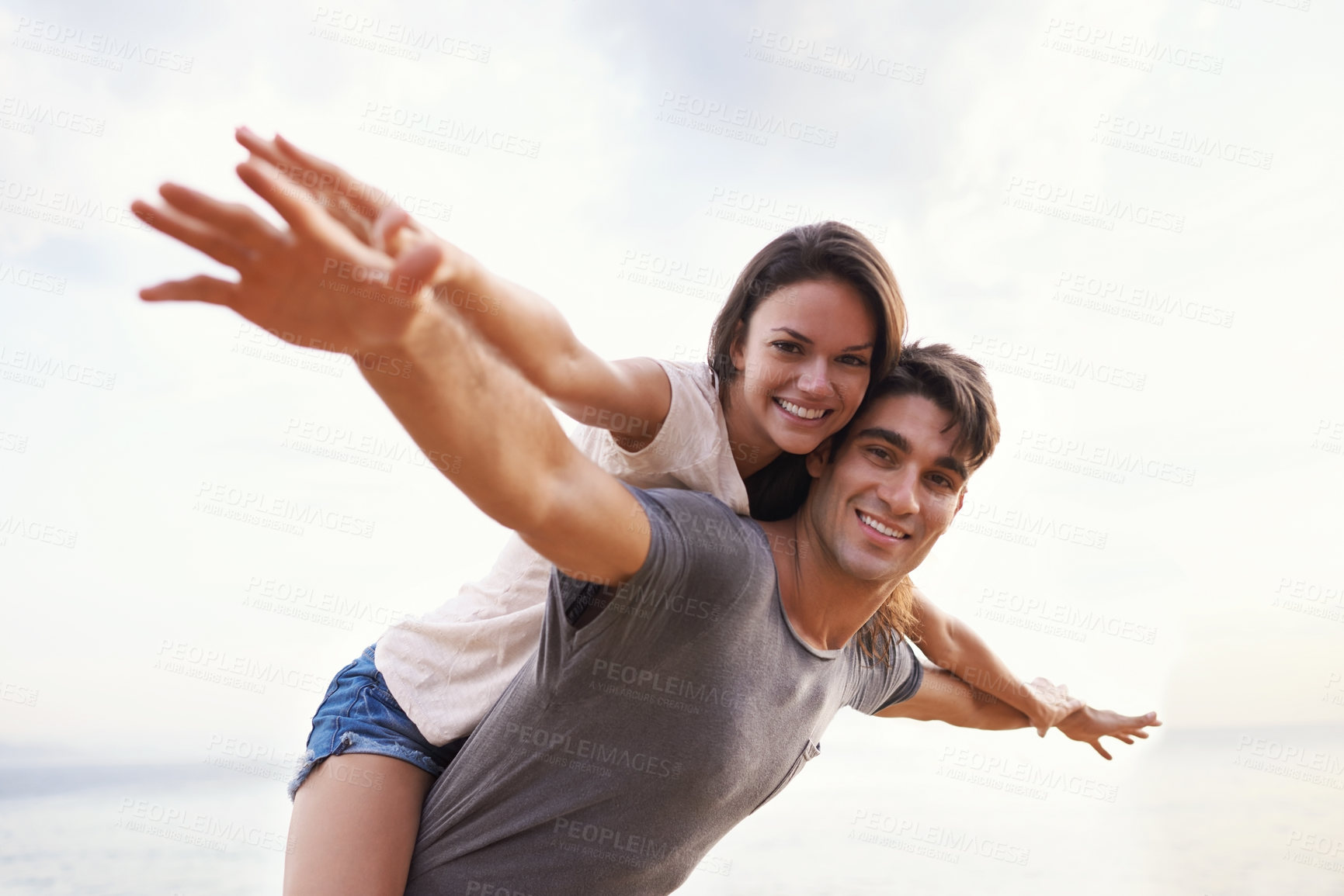 Buy stock photo Couple, beach and piggyback with freedom, smile and nature with travel and date for relationship. Man, woman and indonesia sea for adventure, vacation and tropical holiday with sunshine and portrait