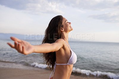 Buy stock photo Happy, woman and smile at ocean, free and summer fun with blue sky and waves on vacation. Relax, holiday peace and hand stretching in nature healing, calm and positive fresh environment on adventure