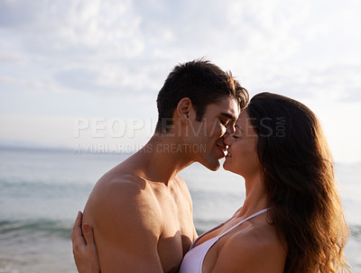 Buy stock photo Beach, kiss and couple with love on holiday or travel on vacation together at sea in summer. Romantic, date and man show gratitude for woman and smile with kindness, care and support for partner