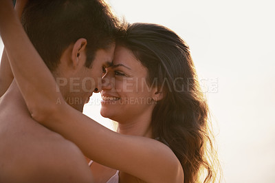 Buy stock photo Love, smile and couple hugging with care on vacation, holiday or adventure together for romance. Happy, sunset and young man and woman embracing in nature on outdoor date on romantic weekend trip.
