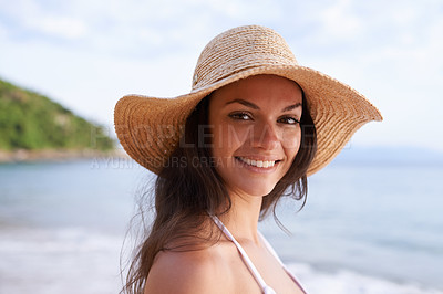 Buy stock photo Beach, happy and portrait of woman for travel on tropical vacation, adventure or holiday. Smile, nature and female person with hat by ocean or sea water on outdoor summer weekend trip by island.