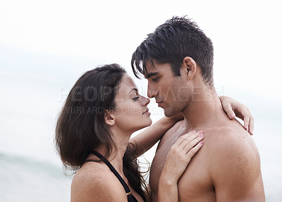 Buy stock photo Love, beach and couple hugging on holiday, adventure or vacation together for tropical travel. Nature, summer and young man and woman embracing with care on romantic date on weekend island trip.