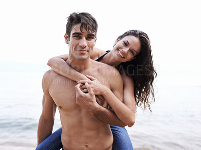 Buy stock photo Portrait, love and happy couple in waves at beach for outdoor travel adventure, summer holiday and embrace. Piggy back, woman and man on vacation in nature on romantic date together with smile.