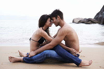 Buy stock photo Couple, embrace and sitting on beach with love in nature on holiday or vacation in summer. People, smile and moment to relax together on date or travel in Florida at sea or hug partner with gratitude