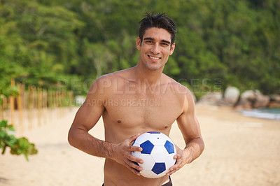 Buy stock photo Portrait, soccer ball and body of man on beach in summer for sports, travel or tropical vacation. Exercise, fitness and football with happy young shirtless person on sand for sports on coastal sand