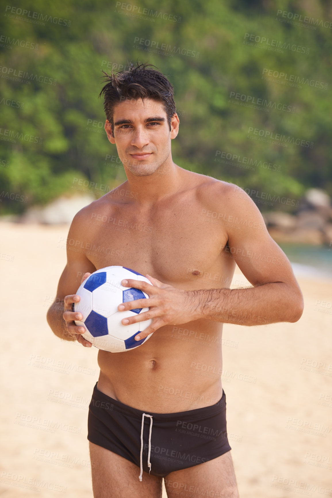 Buy stock photo Beach, portrait and shirtless man with soccer ball in nature for fun summer, weekend break or outdoor vacation. Ocean, swimwear and male person by football for adventure, happiness and sunshine.