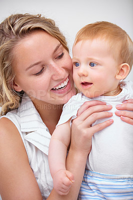 Buy stock photo Happy mother, baby and hug with love for embrace in care, trust or bonding together on holiday at home. Face of mom and little toddler with smile for family, childhood or motherhood in relax at house