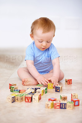Buy stock photo Shot of an adorable baby boy in his home