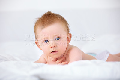 Buy stock photo Cute baby, home and relax for laying down, nappy and comfy for child development and growth. Infant, bed and newborn with blue eyes, house and white bedding for nap time after bath in night routine
