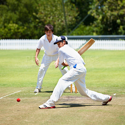 Buy stock photo Cricket player on pitch, teenage boy hitting ball with bat and team sports with fitness, health and active people outdoor. Competition, action and young cricketer with male athlete playing game