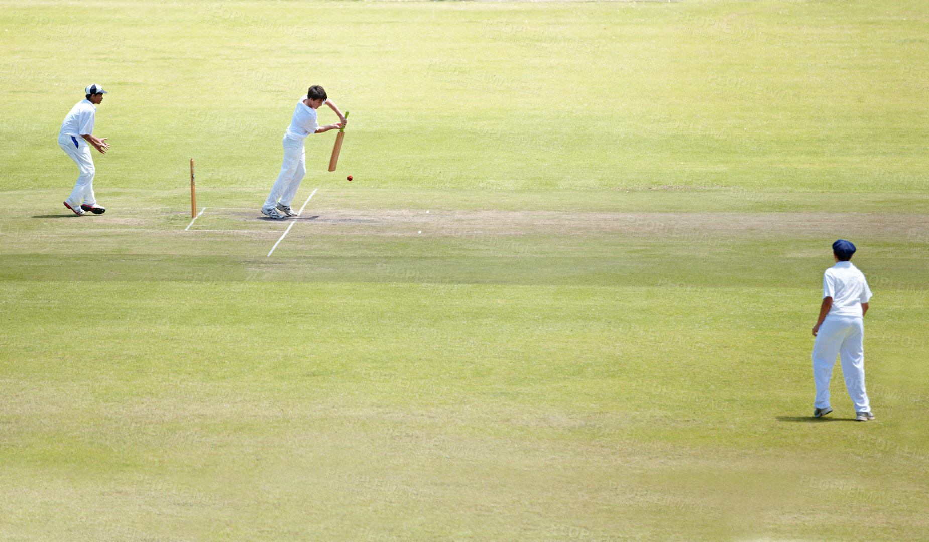 Buy stock photo Cricket team, bat and hitting ball on field, action and professional athlete for playing game. Fitness, batsman or outdoor with teamwork for competition, uniform or stroke with precision to score run