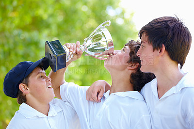 Buy stock photo Teenage boys, winning team with trophy and celebration for sport win, achievement in cricket game and fitness outdoor. Young male athlete celebrate with champion, teamwork and winner of sports match