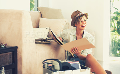 Buy stock photo A beautiful young woman laughing while sitting and holding a record