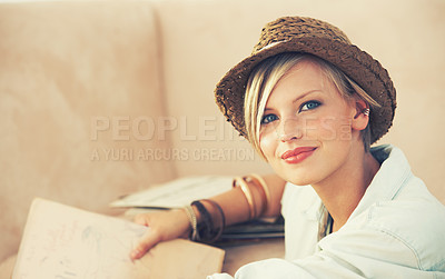 Buy stock photo Portrait, woman and relax on sofa for travel planning for rest and leisure in home in Australia. Happy female person, couch and smile to contemplate tourism idea of break, weekend and getaway