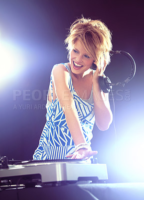 Buy stock photo Woman, dj and record player with headphones for music on stage with lens flare, mixing and gig at rave party for entertainment. Female sound mixer, artist and musician with turntable or playlist