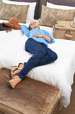 Buy stock photo Woman, hotel room and bed relax with suitcase for travel holiday or accommodation, vacation or weekend. Female person, lying and tourist hospitality in Miami for packing luggage, comfortable or rest