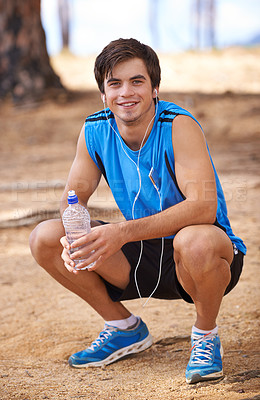 Buy stock photo Portrait, water or happy man on break with earphones in outdoor exercise or fitness workout for podcast. Runner, nature or athlete listening to playlist for streaming radio, music or sports training