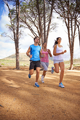 Buy stock photo Wood, running and group for outdoor on forest trail, environment and nature in summer for exercise. Diverse, friends and people in park for training, sport and fitness with trees on mockup space