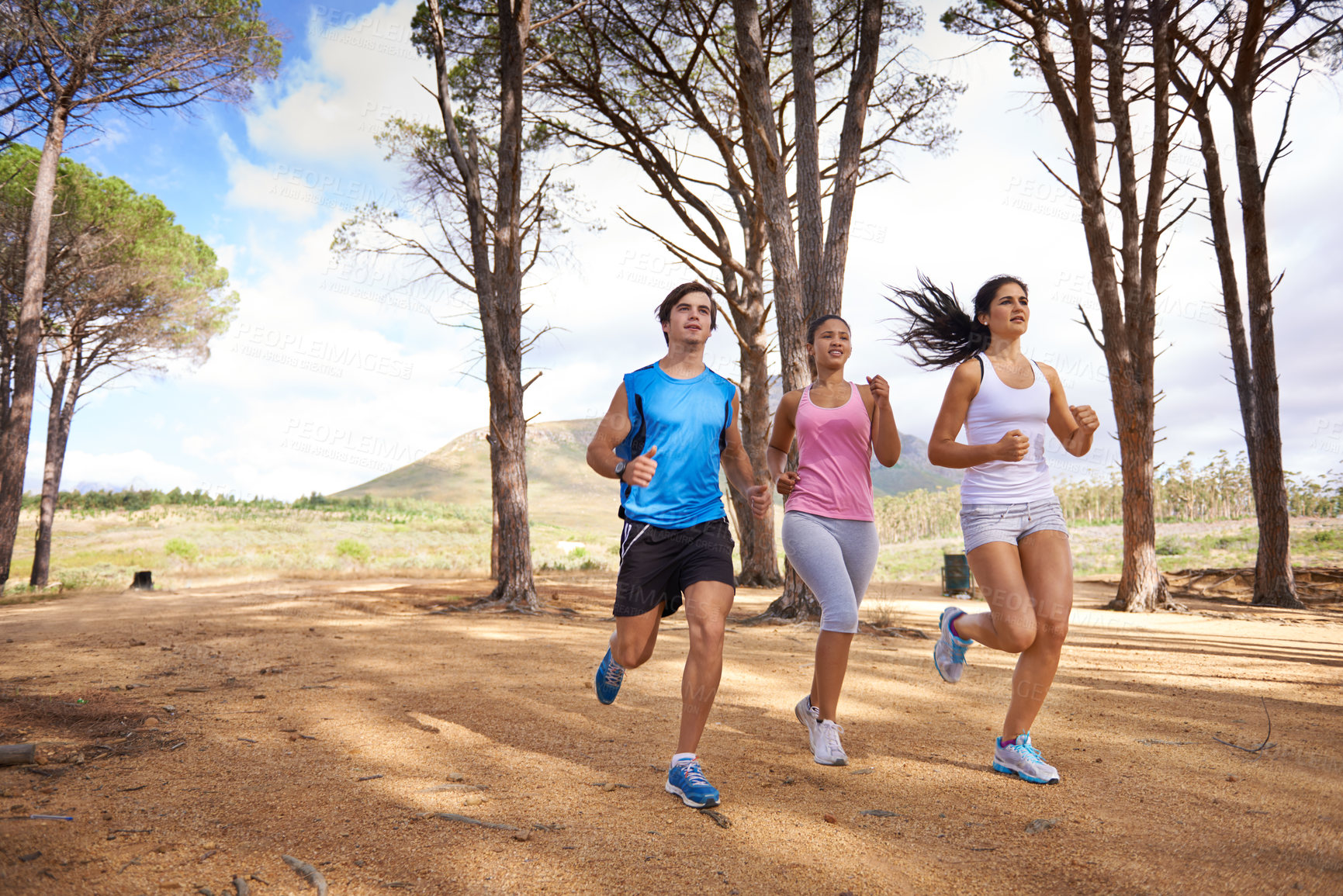 Buy stock photo Fitness, group or friends in nature running for exercise, training or outdoor workout together. People, fast runners or athletes at a park for sports endurance, wellness or cardio challenge in woods